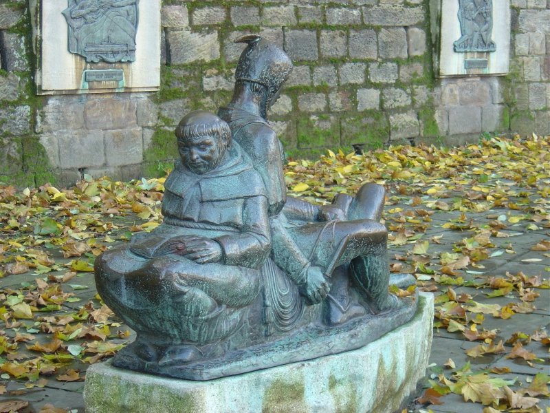 Friar Tuck reads to Little John and Will Stukley, left side view